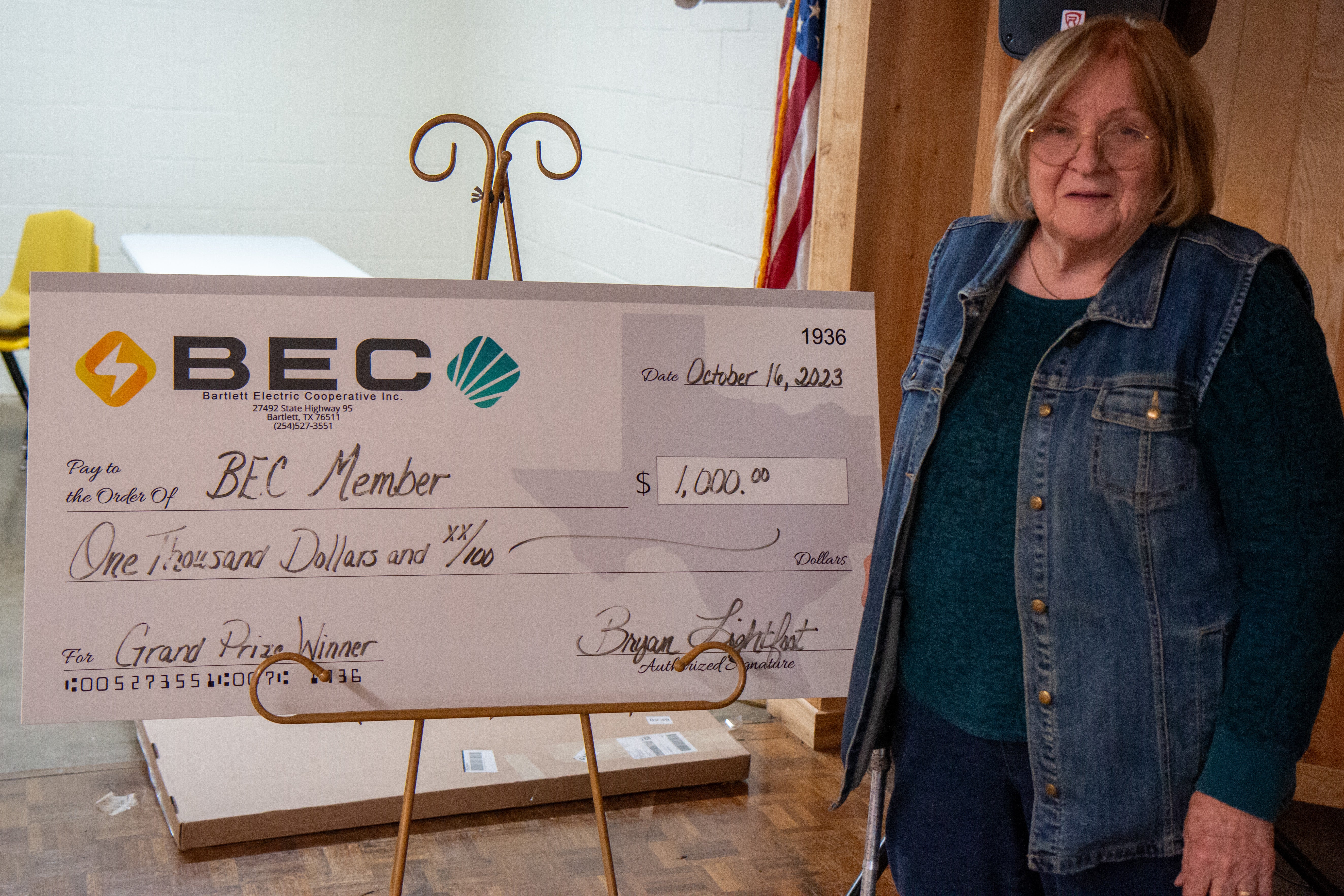 Member with Large Check