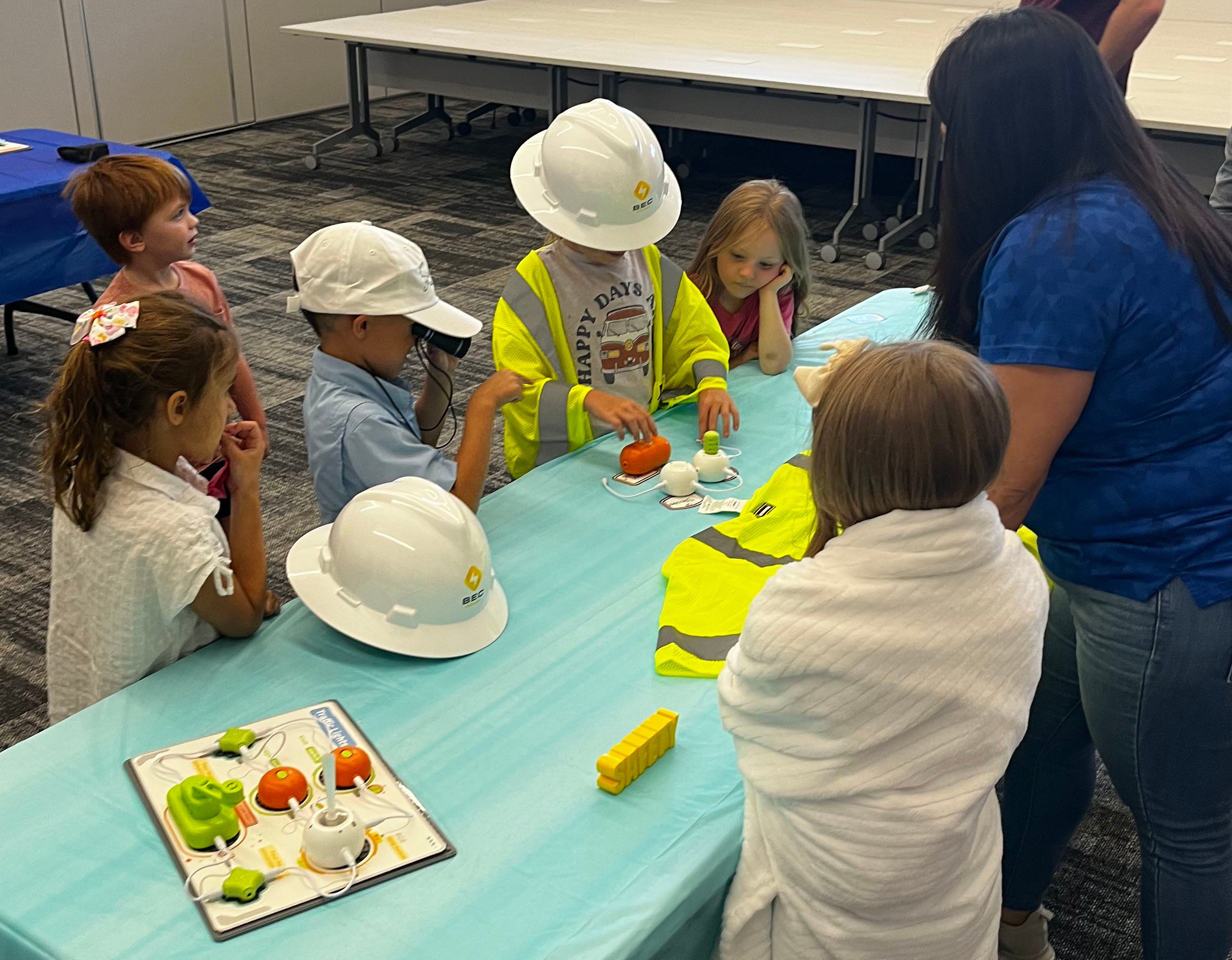 Children participate in an electric cooperative classroom presentation, learning about electrical safety and energy through hands-on activities