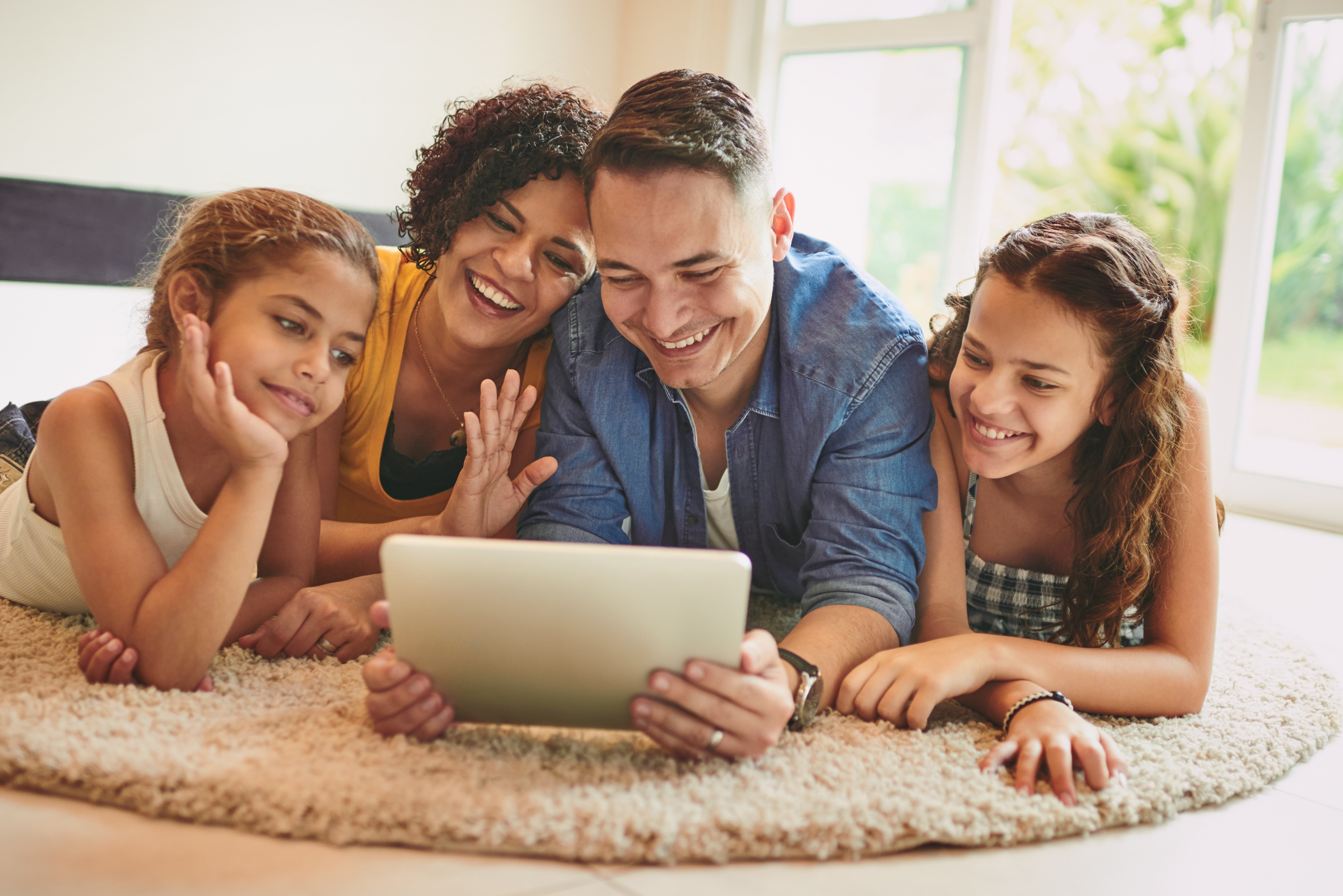Family at home connected through electricity and high-speed internet from Bartlett Electric Cooperative in Texas communities