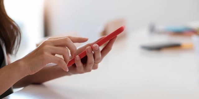 TextPower cell phone woman holding image