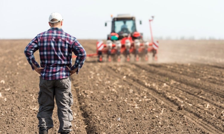 Spotter in field with tractor