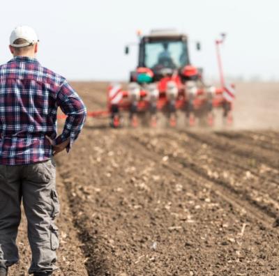 Spotter in field with tractor